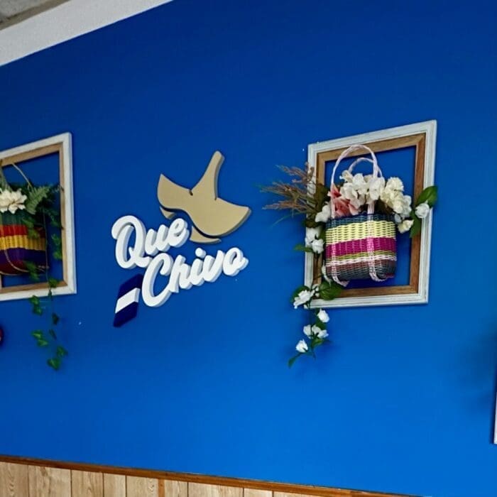 A blue wall with white text and baskets on it, creating a stylish backdrop often seen in unique restaurants in Frederick MD.