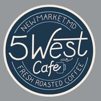 A circular logo with a dark blue center and cream border, it reads “5 West Cafe” in large script, features a steaming coffee cup, and highlights New Market MD along with “FRESH ROASTED COFFEE.”.